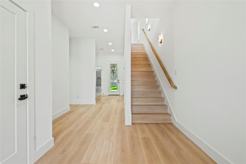1312 Compton Street Dallas, TX 75203 - Photo 6 of 31 a view of a hallway with wooden floor and entryway
