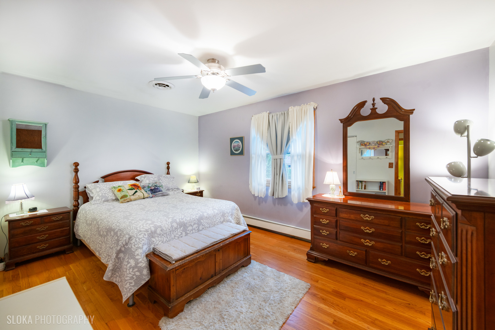 101 Clay Street Algonquin, IL 60102 - Photo 13 of 23 a bedroom with a bed a dresser and mirror