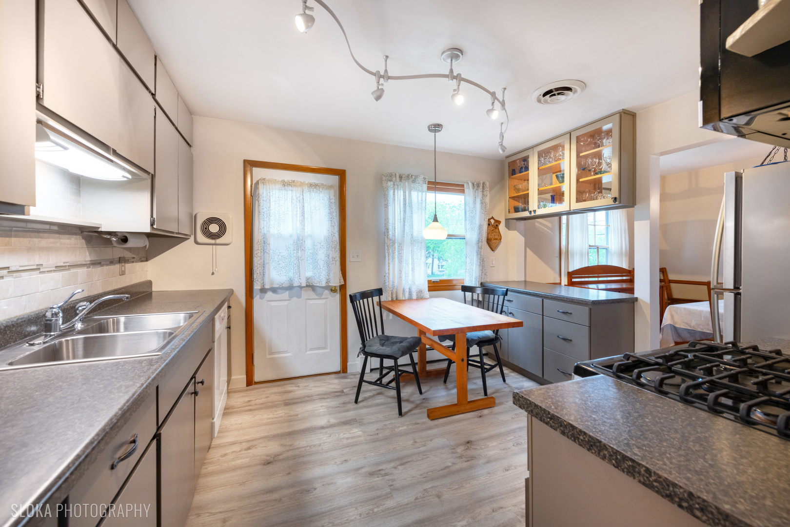 101 Clay Street Algonquin, IL 60102 - Photo 3 of 23 a kitchen with stainless steel appliances granite countertop a sink stove and refrigerator