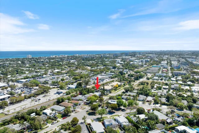 an aerial view of residential houses with city view