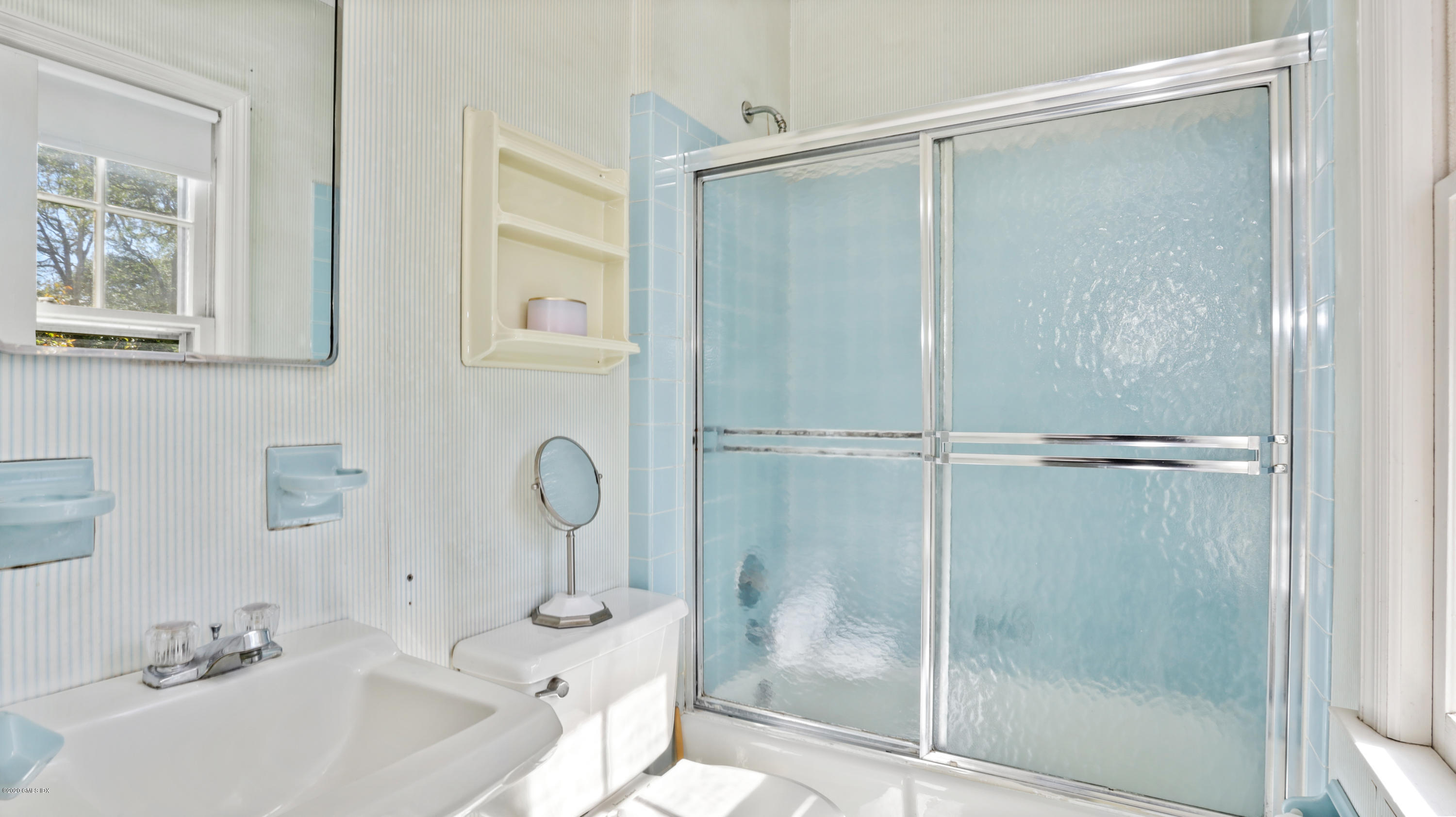 30 Hendrie Avenue Riverside, CT 06878 - Photo 16 of 31 a bathroom with a sink and a mirror