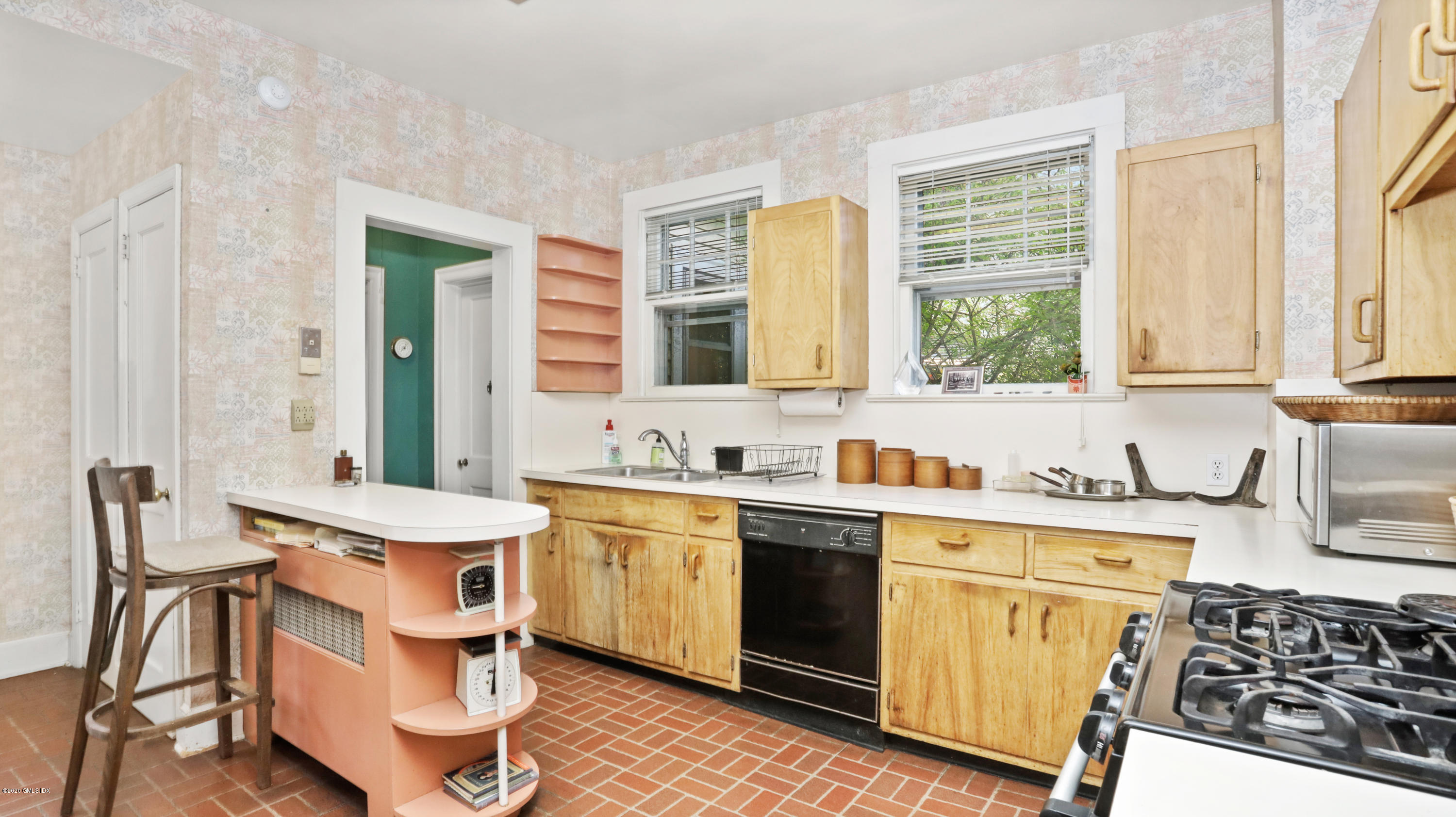 30 Hendrie Avenue Riverside, CT 06878 - Photo 8 of 31 a kitchen with a sink stove and cabinets