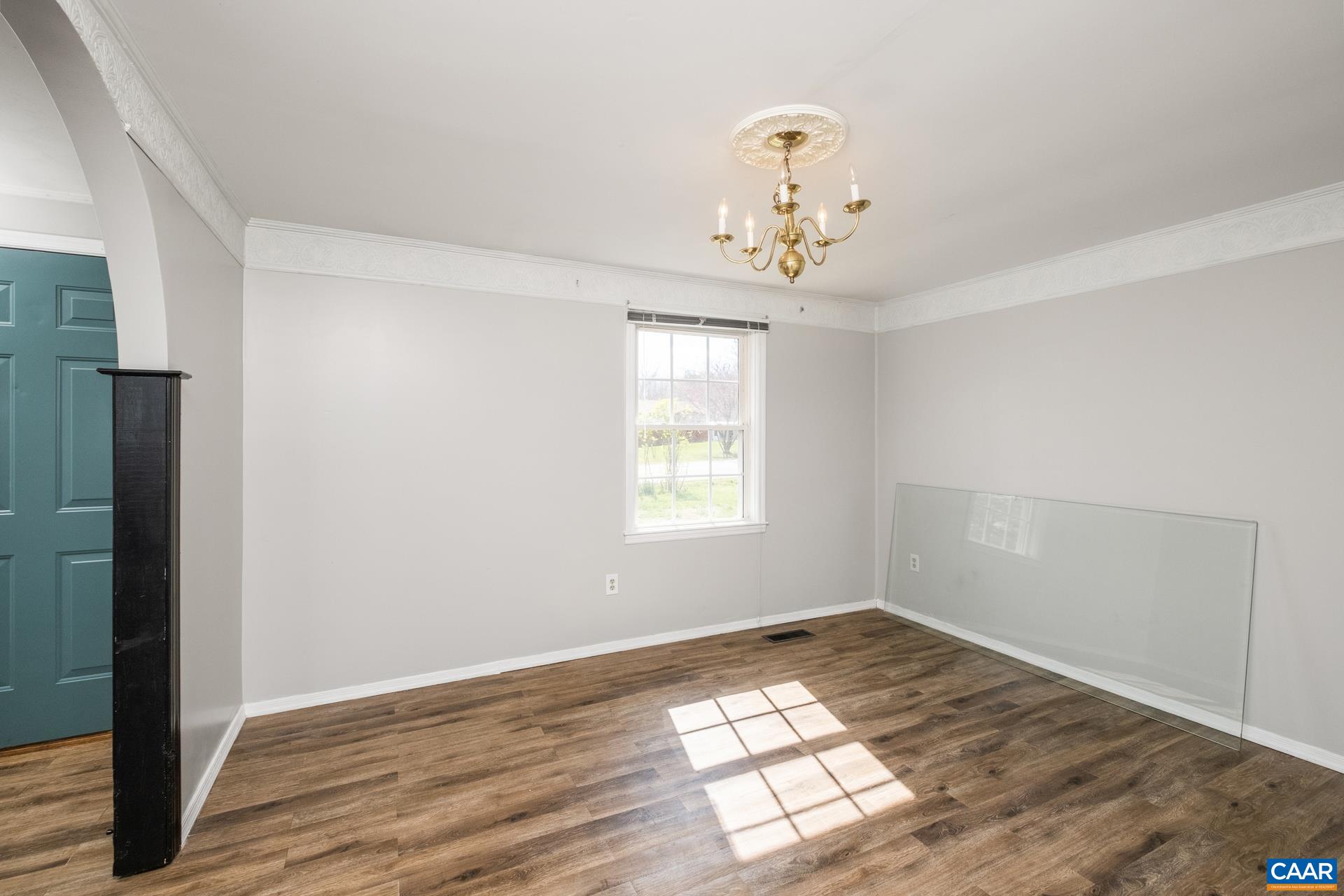 397 Carpenters Mill Road Ruckersville, VA 22968 - Photo 11 of 30 an empty room with wooden floor and windows