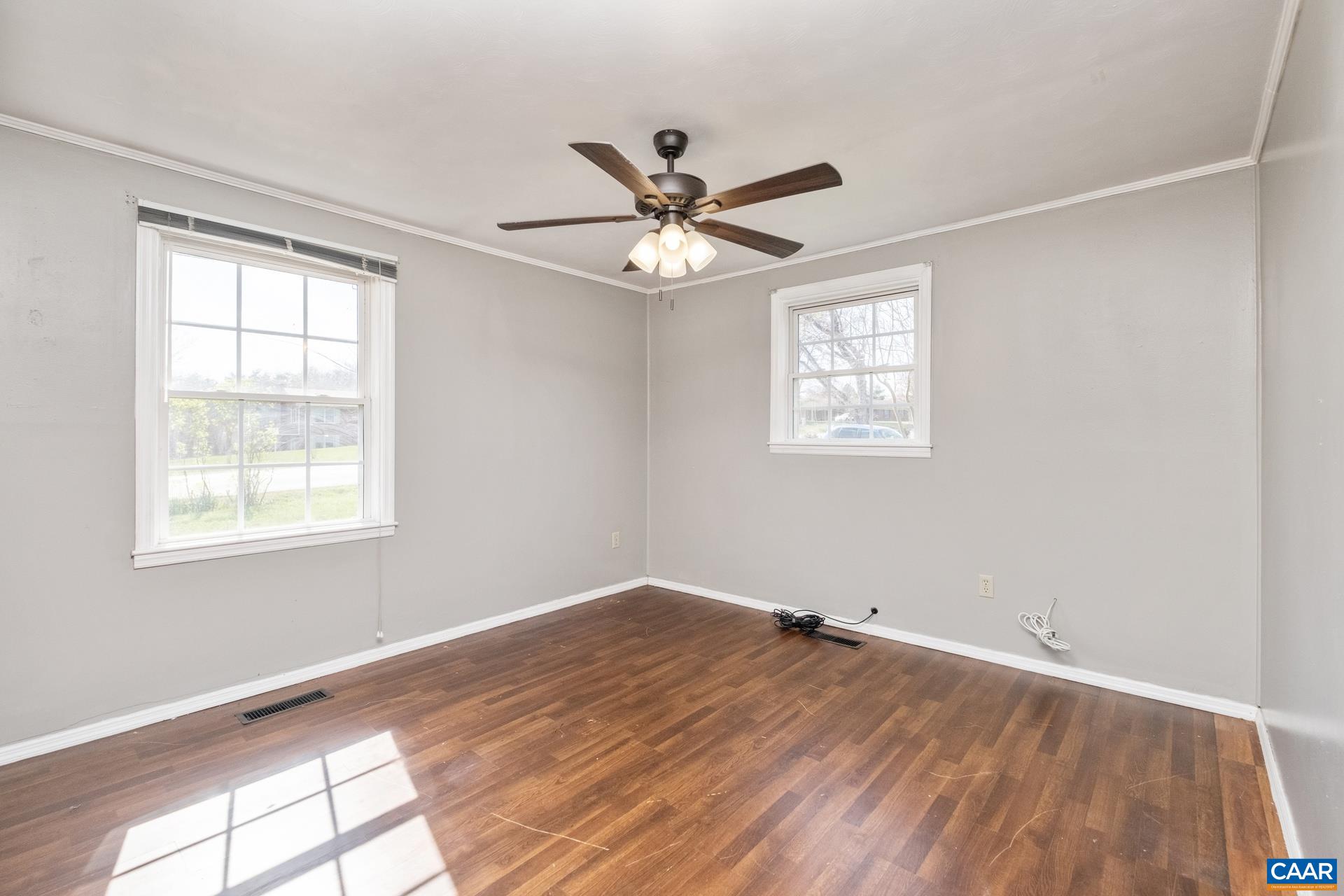 397 Carpenters Mill Road Ruckersville, VA 22968 - Photo 14 of 30 a view of empty room with wooden floor and fan