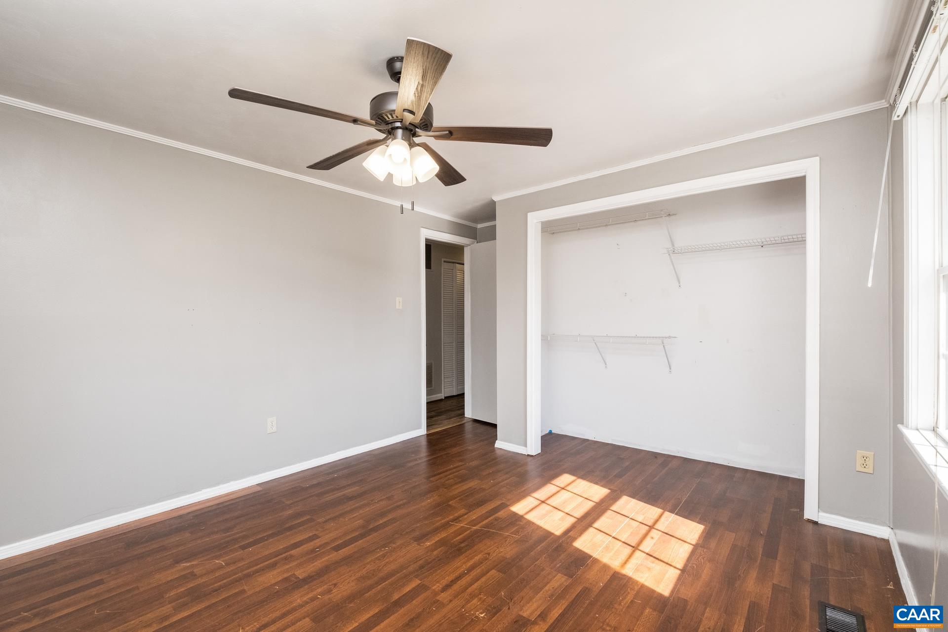 397 Carpenters Mill Road Ruckersville, VA 22968 - Photo 15 of 30 a view of empty room with wooden floor and fan