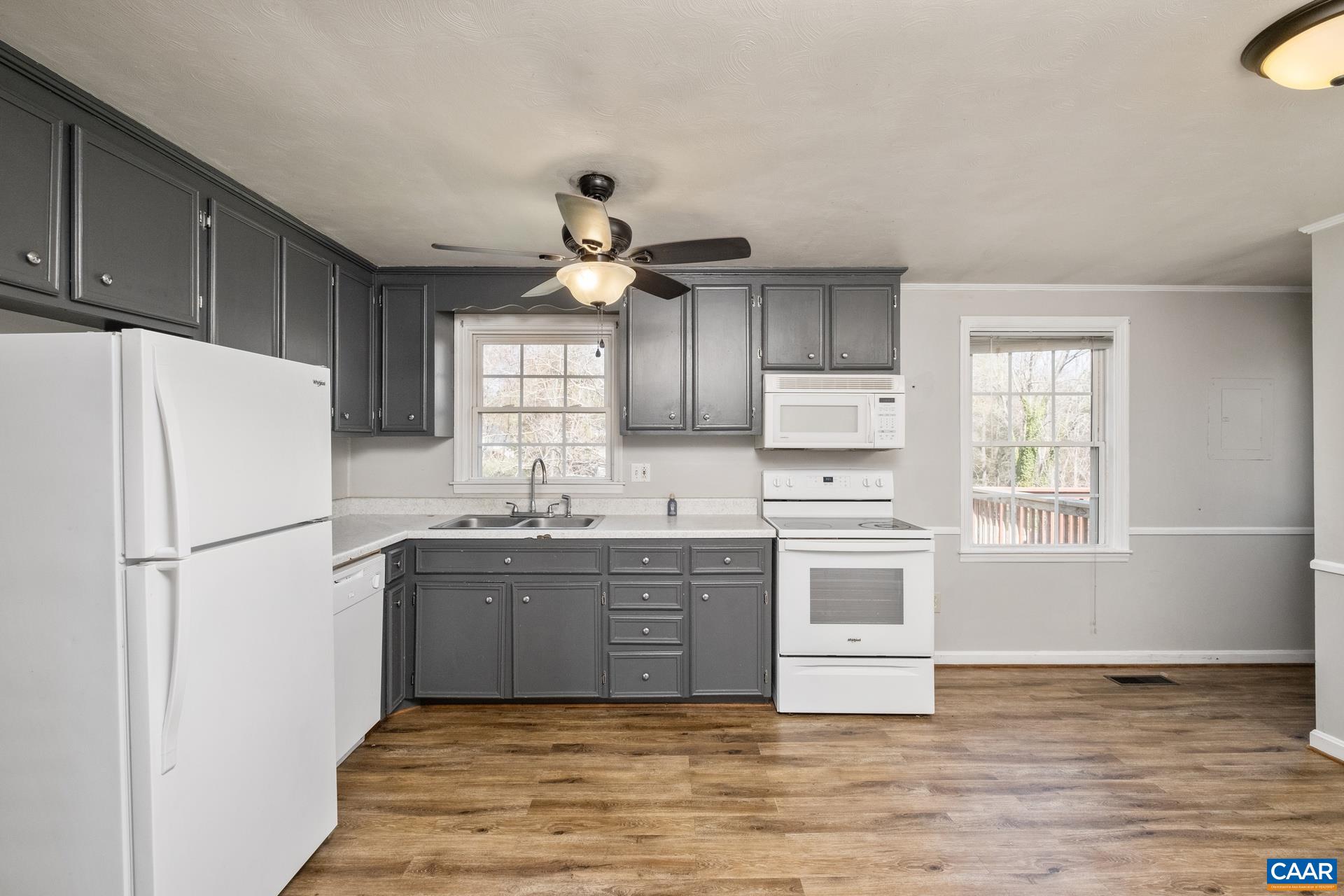 397 Carpenters Mill Road Ruckersville, VA 22968 - Photo 5 of 30 a kitchen with stainless steel appliances granite countertop a sink a stove a refrigerator and cabinets