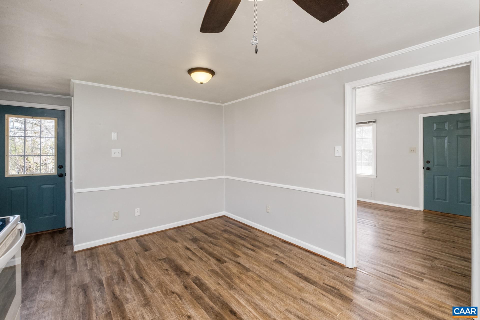 397 Carpenters Mill Road Ruckersville, VA 22968 - Photo 7 of 30 an empty room with wooden floor and windows