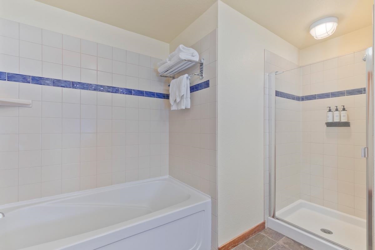 6201 Minaret Road, Unit 2215 Mammoth Lakes, CA 93546 - Photo 20 of 33 a bathroom with a bathtub and shower