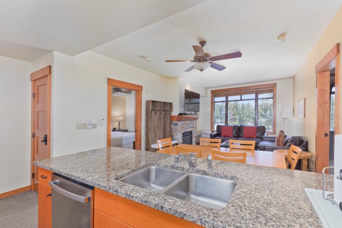 6201 Minaret Road, Unit 2215 Mammoth Lakes, CA 93546 - Photo 7 of 33 a kitchen view with granite countertop a sink and a refrigerator