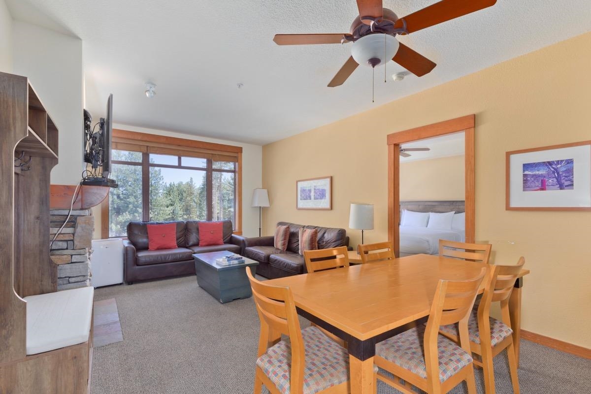 6201 Minaret Road, Unit 2215 Mammoth Lakes, CA 93546 - Photo 9 of 33 a living room with fireplace furniture and a large window