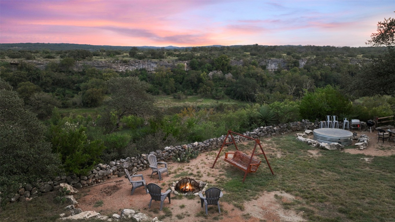 5229-5012 Hupedo Ranch Road Spicewood, TX 78669 - Photo 26 of 40 a view of a lake with mountains in the background