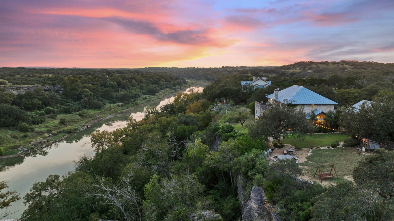 5229-5012 Hupedo Ranch Road Spicewood, TX 78669 - Photo 3 of 40 a view of a lake with a mountain in the background