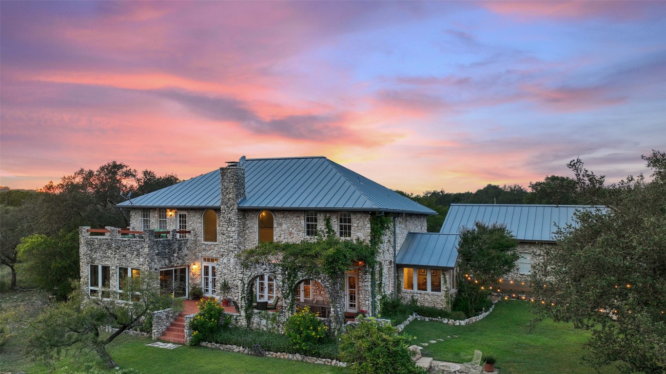 5229-5012 Hupedo Ranch Road Spicewood, TX 78669 - Photo 4 of 40 a front view of a house with garden