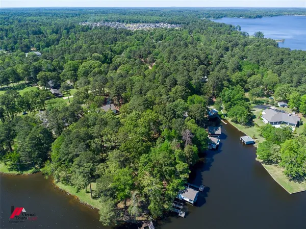 an aerial view of a houses with a yard