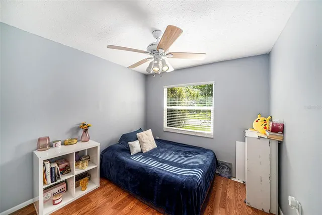 a bedroom with furniture and a window