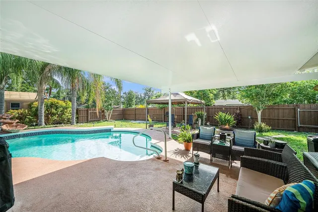 a patio with yard table and chairs