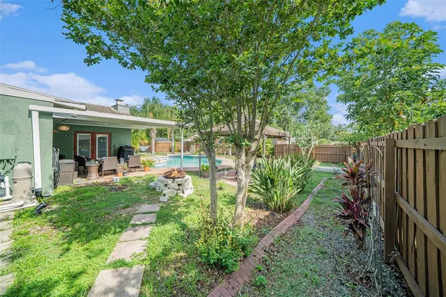 a view of a house with backyard porch and sitting area