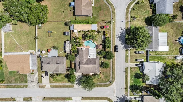 an aerial view of residential houses with outdoor space