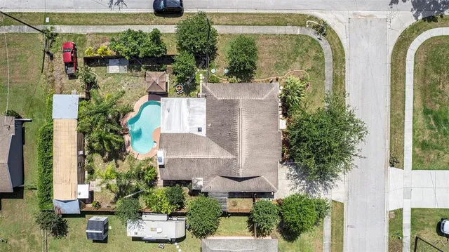 an aerial view of a house with outdoor space