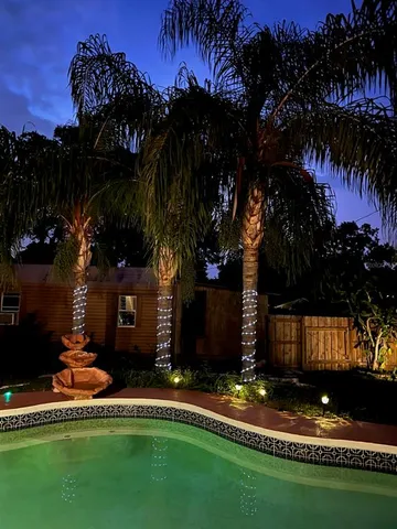 a view of a house with a yard and a garden