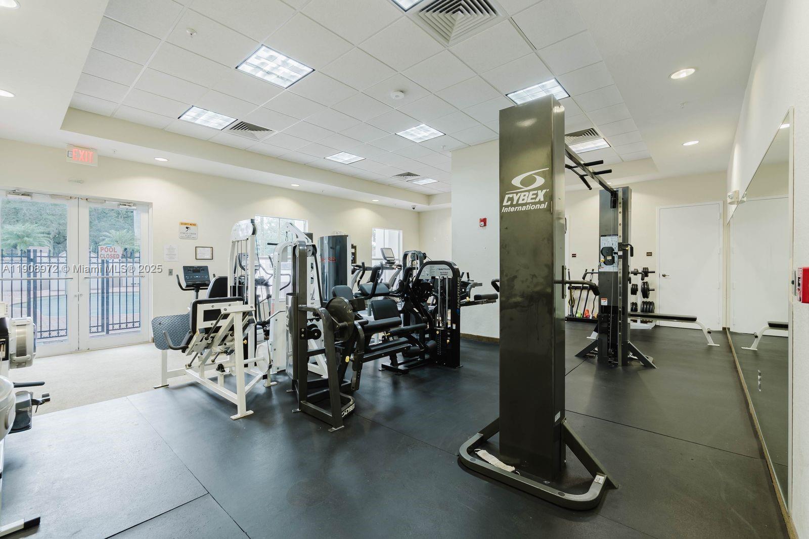 9021 Southwest 94th Street, Unit 307 Miami, FL 33176 - Photo 17 of 18 a view of a room with gym equipment