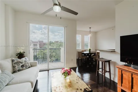 a living room with furniture and flat screen tv