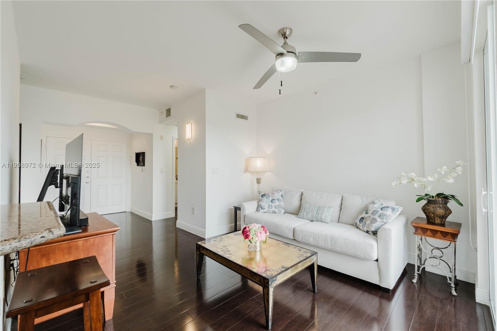9021 Southwest 94th Street, Unit 307 Miami, FL 33176 - Photo 5 of 18 a living room with furniture and wooden floor