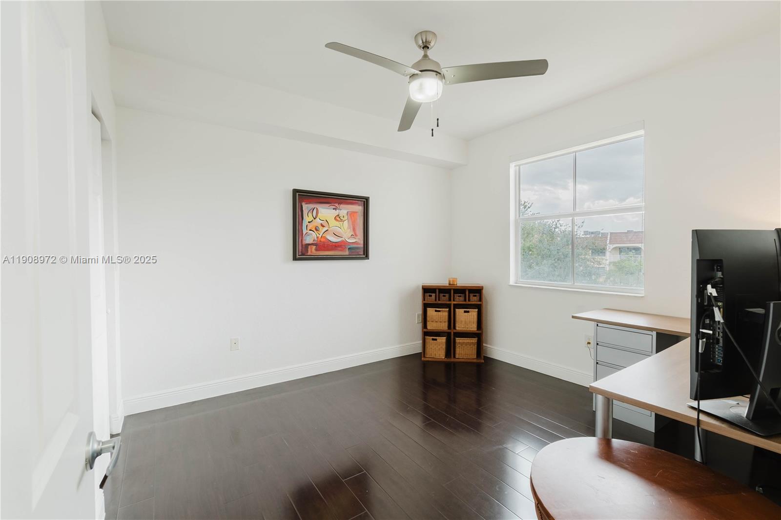 9021 Southwest 94th Street, Unit 307 Miami, FL 33176 - Photo 7 of 18 a view of a livingroom with workspace and a window