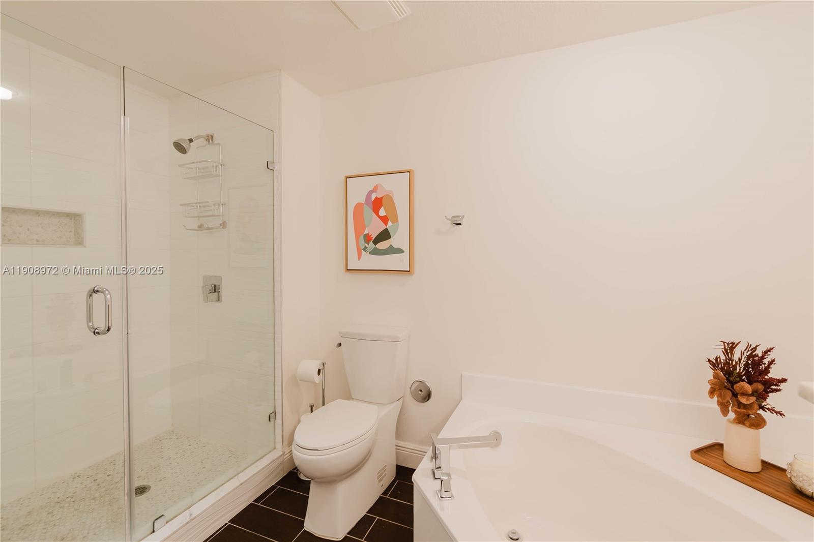 9021 Southwest 94th Street, Unit 307 Miami, FL 33176 - Photo 10 of 18 a bathroom with a toilet and a shower