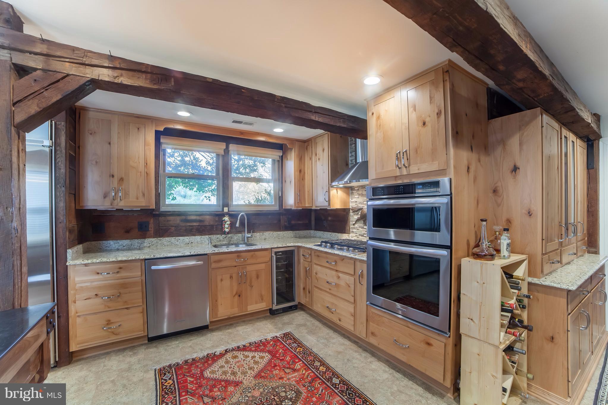 5515 Riggs Road Gaithersburg, MD 20882 - Photo 6 of 30 Kitchen with SS appliances. Wine refrigerator too