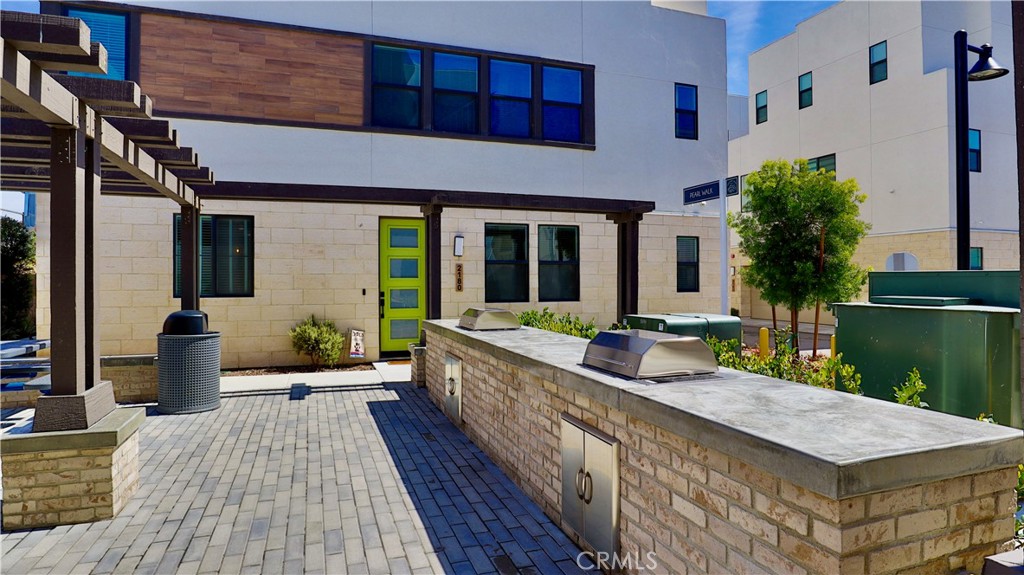 2180 Pearl Walk Gardena, CA 90249 - Photo 19 of 23 a front view of a house with outdoor seating