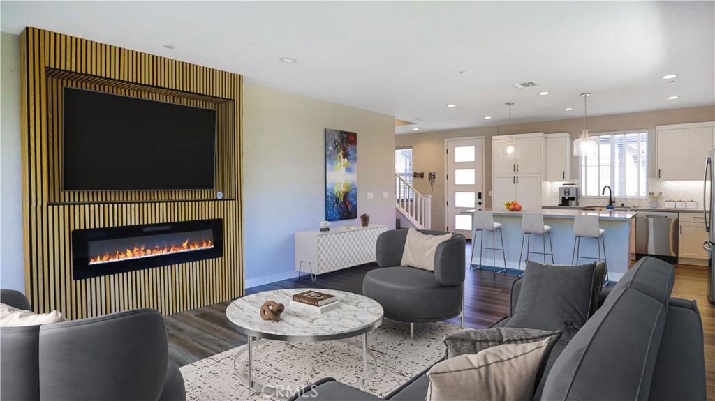 2180 Pearl Walk Gardena, CA 90249 - Photo 2 of 23 a living room with furniture a flat screen tv and a fireplace