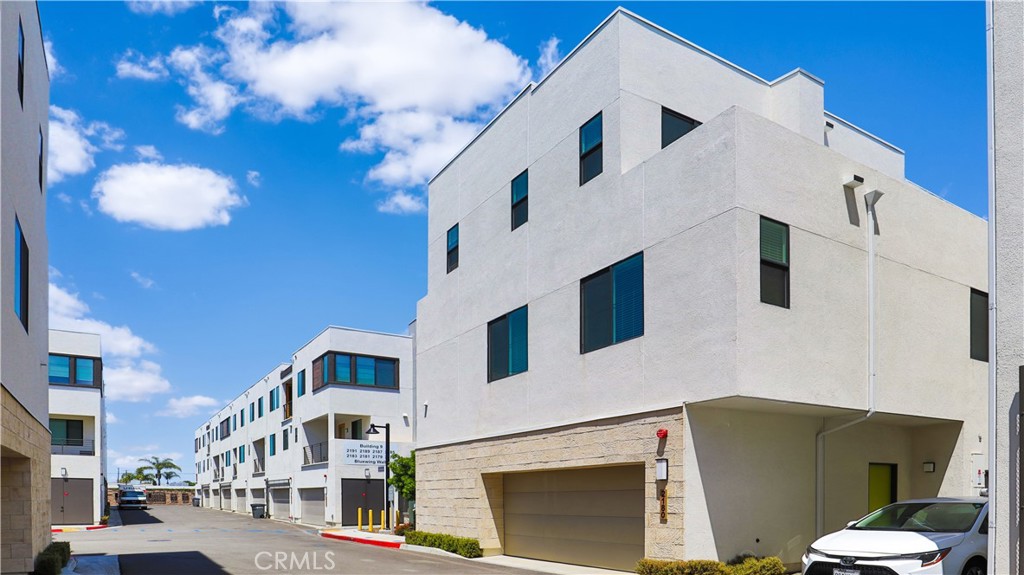 2180 Pearl Walk Gardena, CA 90249 - Photo 22 of 23 a view of a white building with many windows