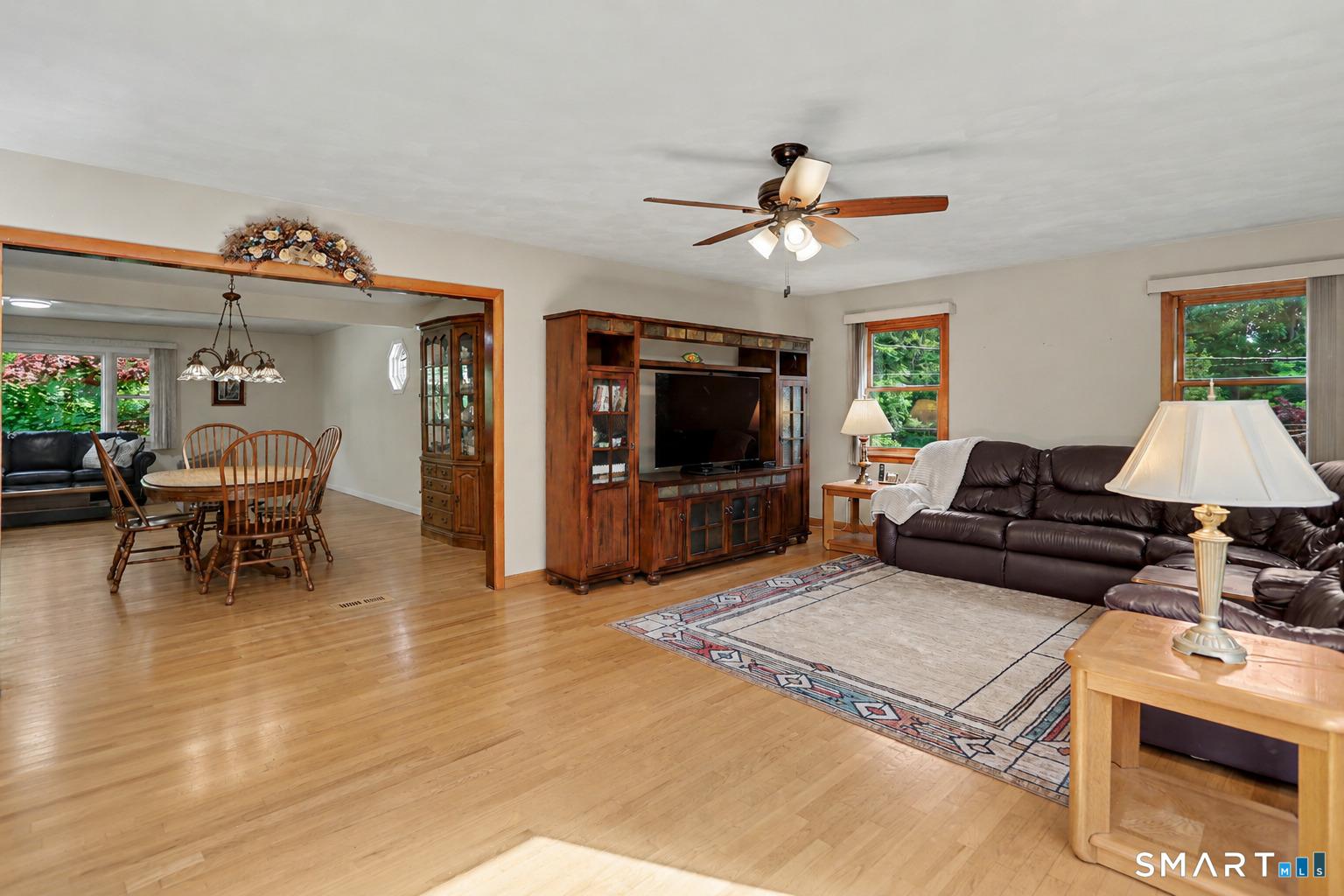 632 Wheelers Farm Road Orange, CT 06477 - Photo 15 of 39 a living room with furniture and a flat screen tv
