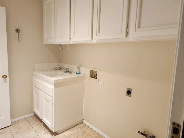 a bedroom with a bed and glass window