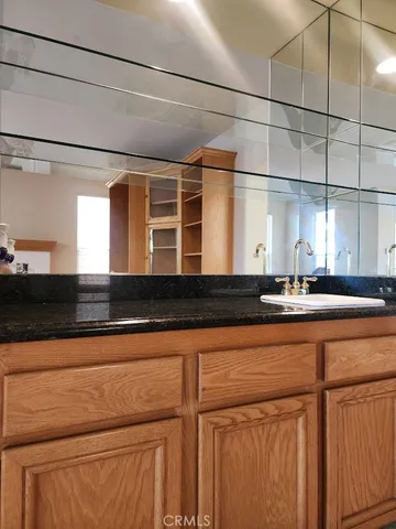 a bedroom with bed and a window