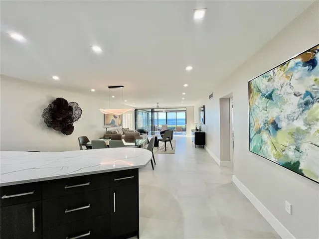 a kitchen with a sink stainless steel appliances and cabinets