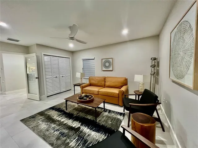 a living room with furniture and a window