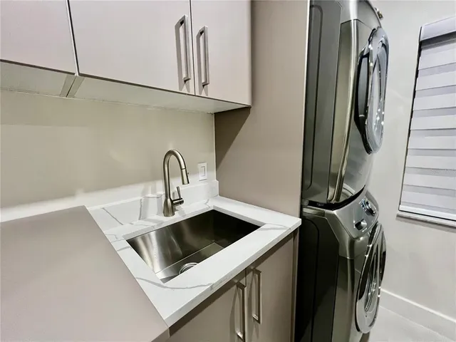 a close view of a sink and a washer and dryer