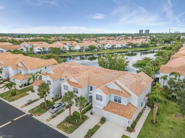 an aerial view of a house with a lake view