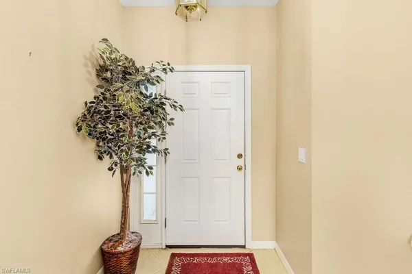 a view of entryway with paintings on the wall
