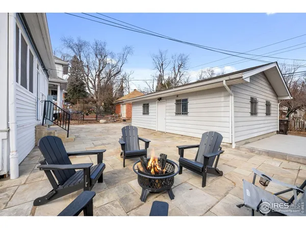a view of a patio with couple of chairs