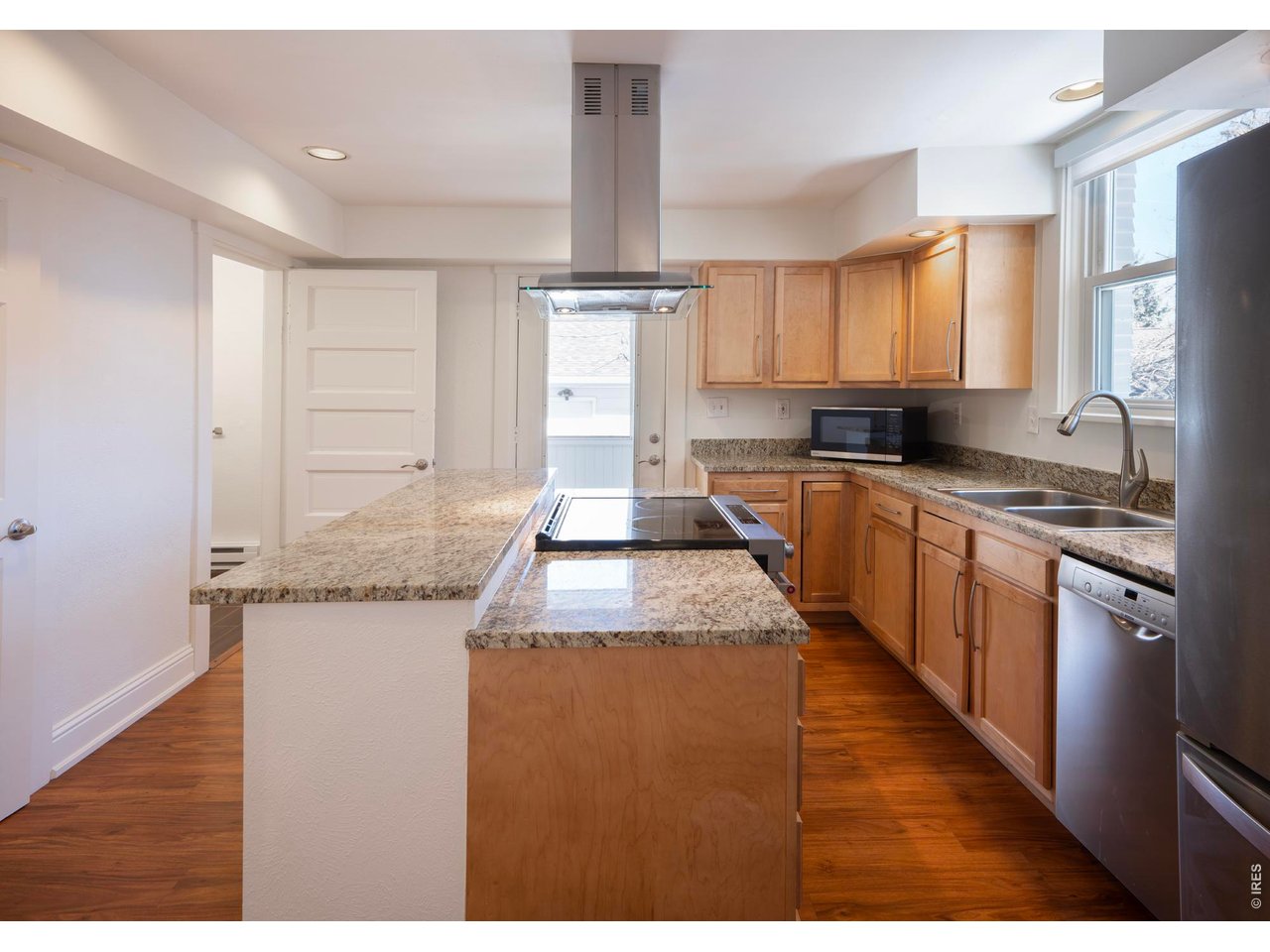 613 Pine Street Boulder, CO 80302 - Photo 15 of 23 a kitchen with stainless steel appliances granite countertop a sink stove and refrigerator