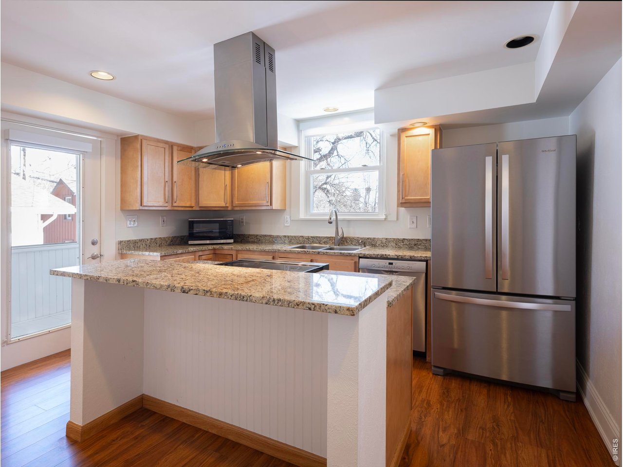 613 Pine Street Boulder, CO 80302 - Photo 16 of 23 a kitchen with granite countertop a sink and a refrigerator