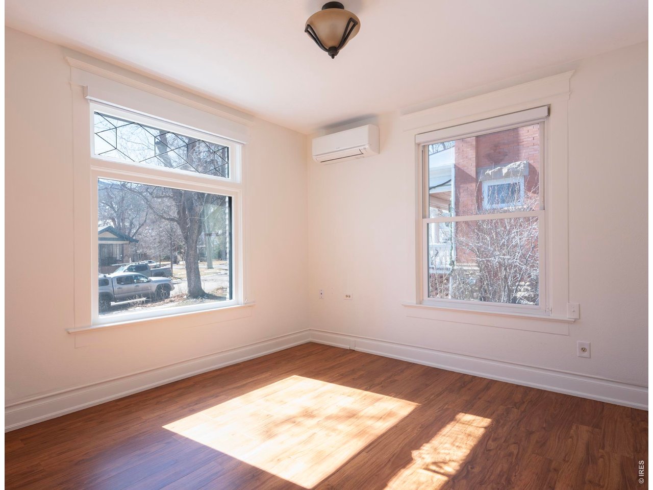 613 Pine Street Boulder, CO 80302 - Photo 18 of 23 a view of an empty room with wooden floor and a window