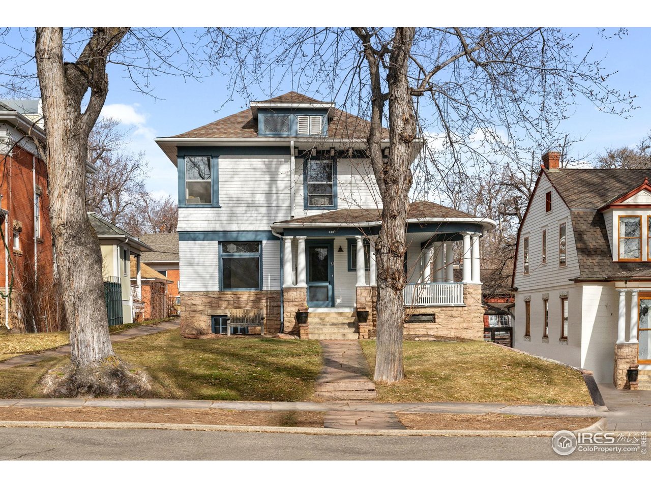613 Pine Street Boulder, CO 80302 - Photo 2 of 23 a front view of a house with a yard