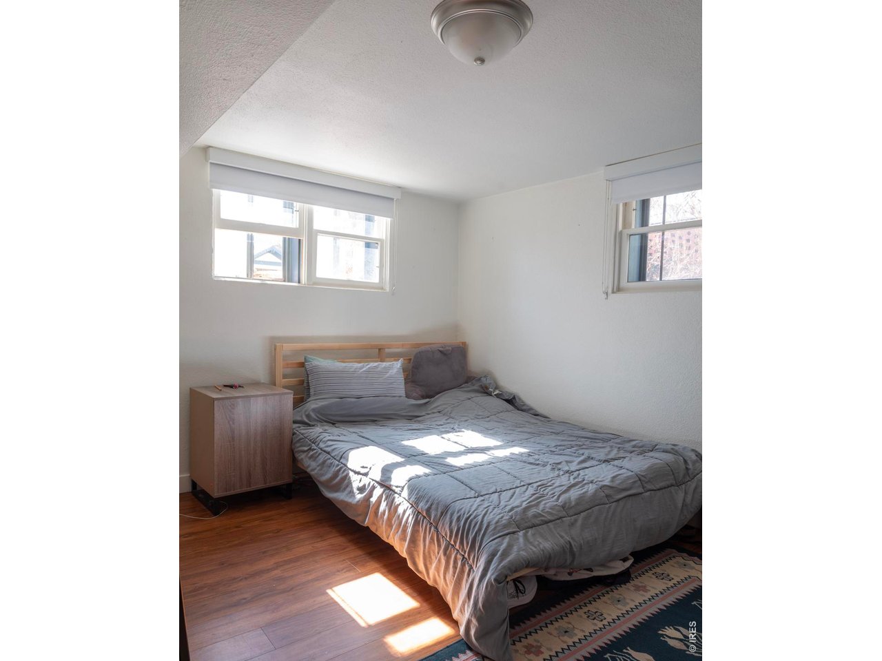 613 Pine Street Boulder, CO 80302 - Photo 21 of 23 a bedroom with a bed and a window