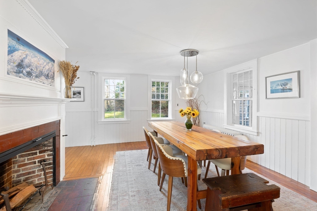 118 Main Street Sandwich, MA 02563 - Photo 11 of 41 a view of a dining room with furniture wooden floor and a chandelier