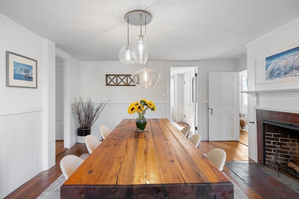 118 Main Street Sandwich, MA 02563 - Photo 13 of 41 a living room with furniture and a fireplace