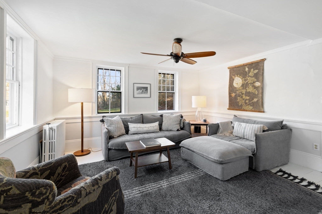 118 Main Street Sandwich, MA 02563 - Photo 19 of 41 a living room with furniture and a large window